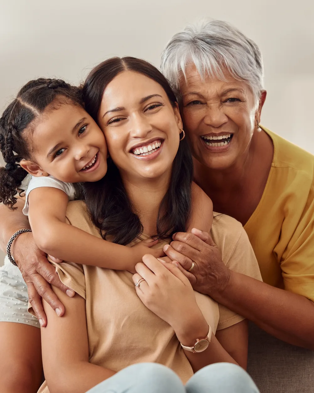 Smiling family seated together indoors