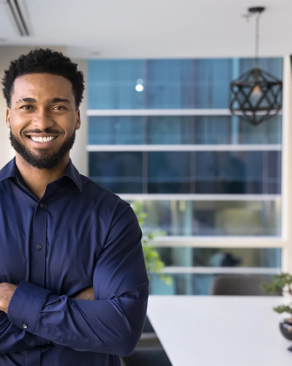 Smiling adult patient in a bright dental office setting