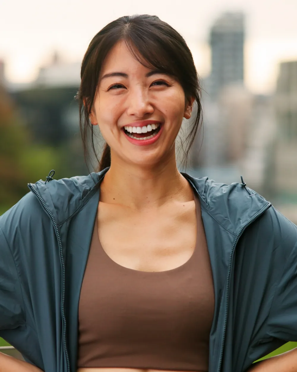 Smiling woman in activewear outdoors