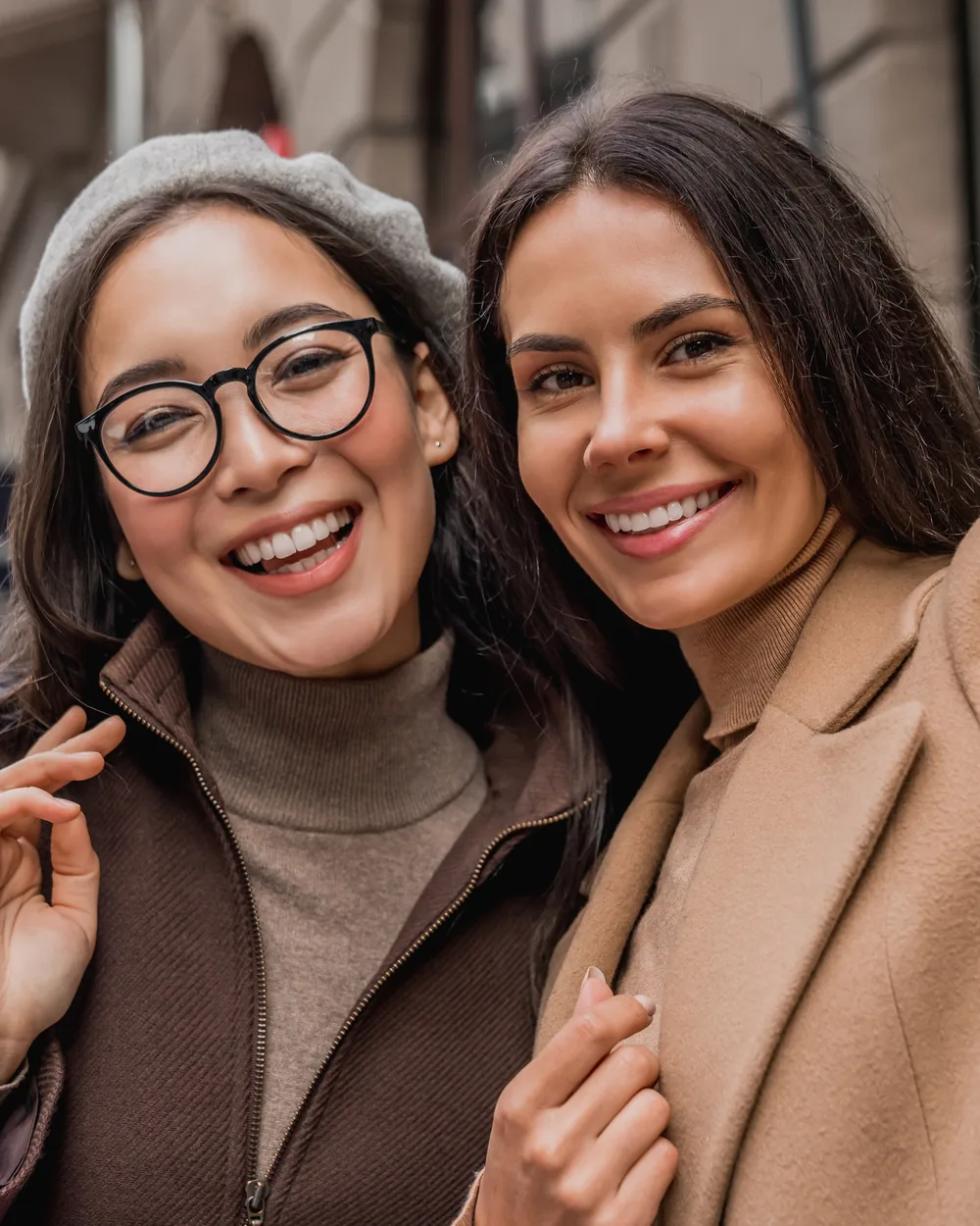 Two smiling young women taking a selfie