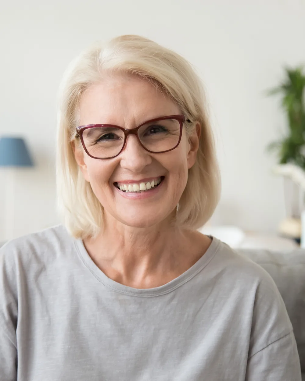 Smiling older woman relaxing at home
