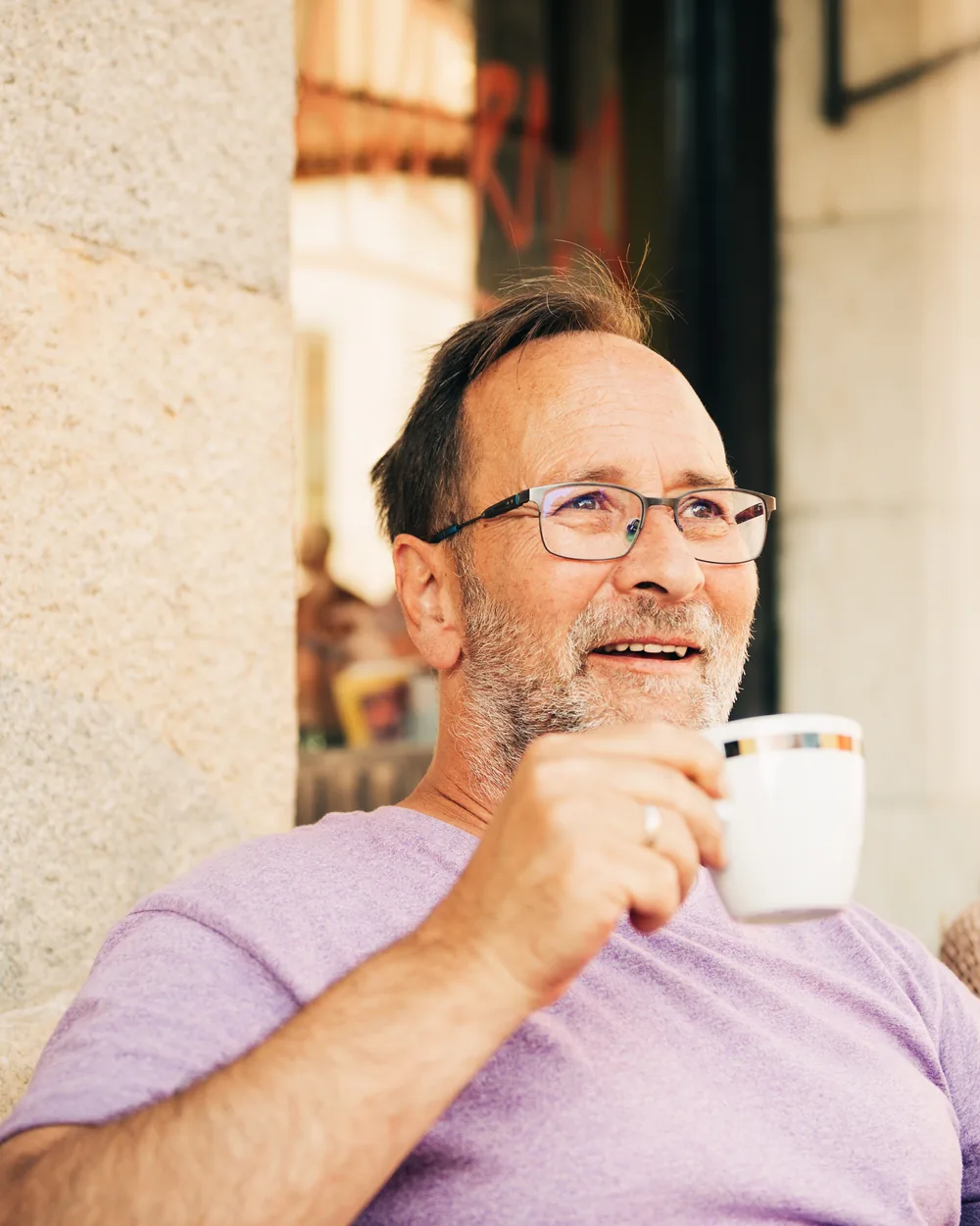 Relaxed man enjoying coffee outdoors