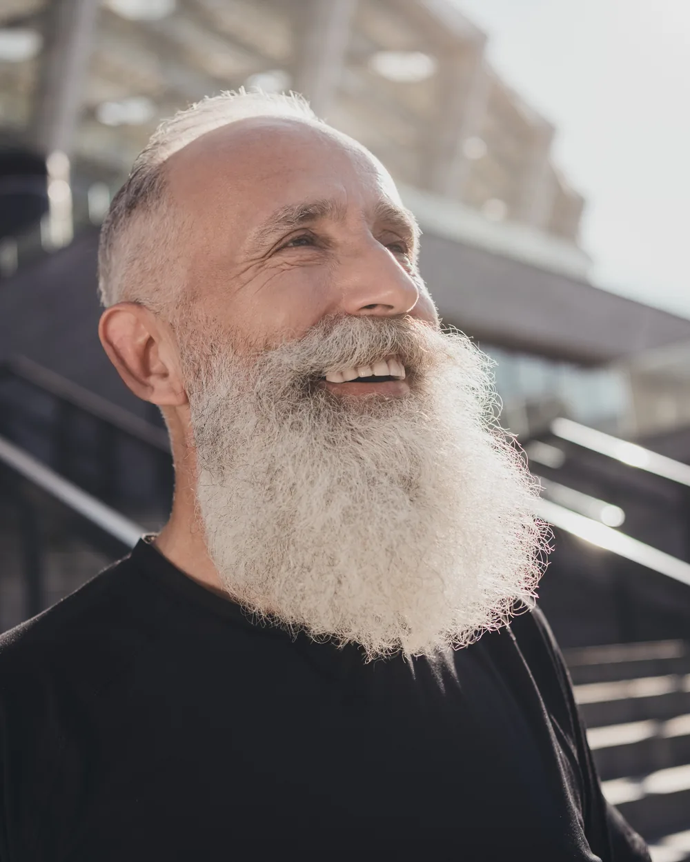 Smiling older man in sunlight