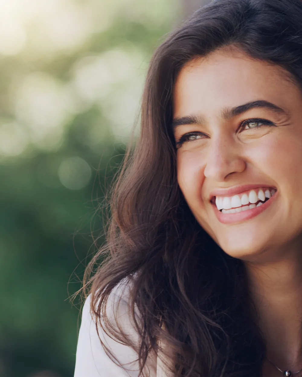 Smiling woman in a close-up outdoor portrait